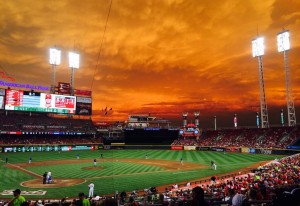 The field at Great American Ballpark with an orange sky.
